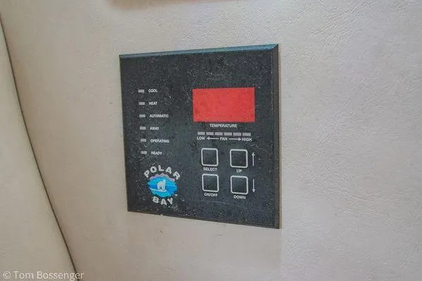 Slide: The Image of Control panel of a 2004 Crownline 250 CR boat, featuring Polar Bay temperature settings. - 50