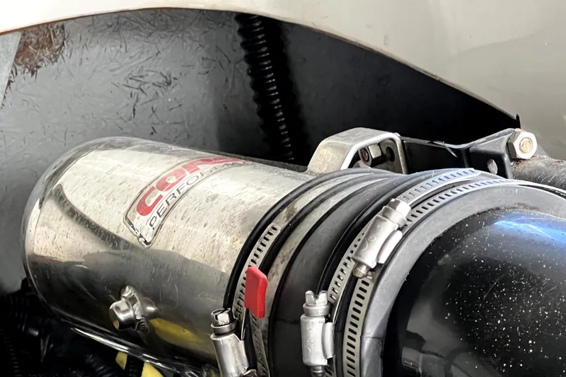 Slide: The Image of Close-up of a 2004 Crownline 250 CR engine component with performance branding. - 54