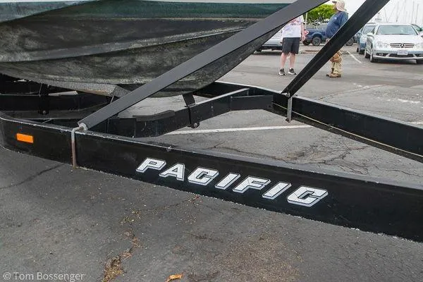 Slide: The Image of Trailer for 2004 Crownline 250 CR boat, labeled "Pacific," parked on asphalt. - 56