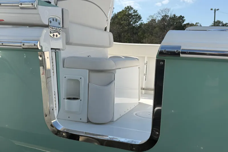 Slide: The Image of 2023 Sea Hunt Ultra 255 SE boat interior with sleek seating and polished metal accents. - 14