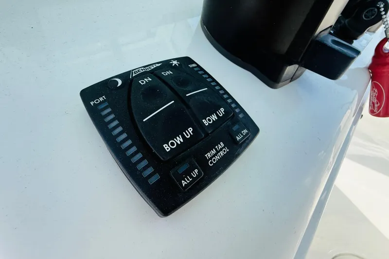 Slide: The Image of Trim tab control panel on 2023 Sea Hunt Ultra 255 SE boat. - 23