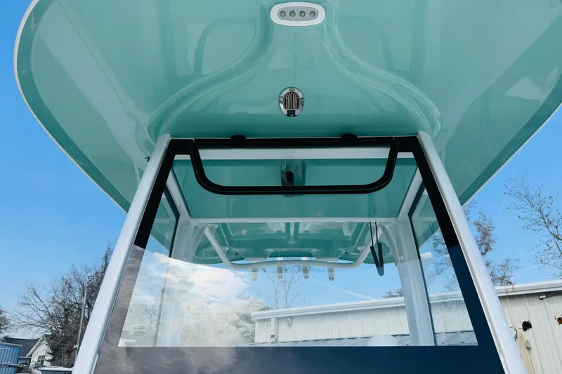 Slide: The Image of 2023 Sea Hunt Ultra 255 SE boat, featuring sleek design and modern canopy. - 9