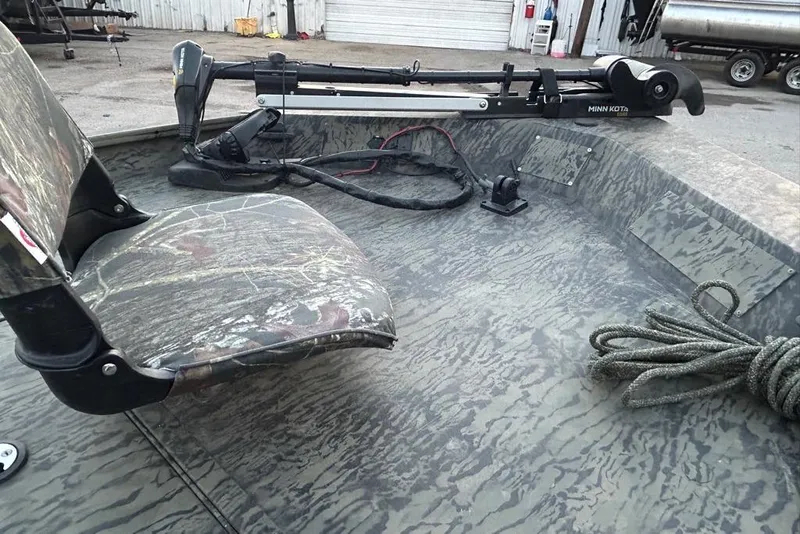 Slide: The Image of 2025 Tracker Grizzly 1860 MVX CC boat on trailer, viewed from below. - 10