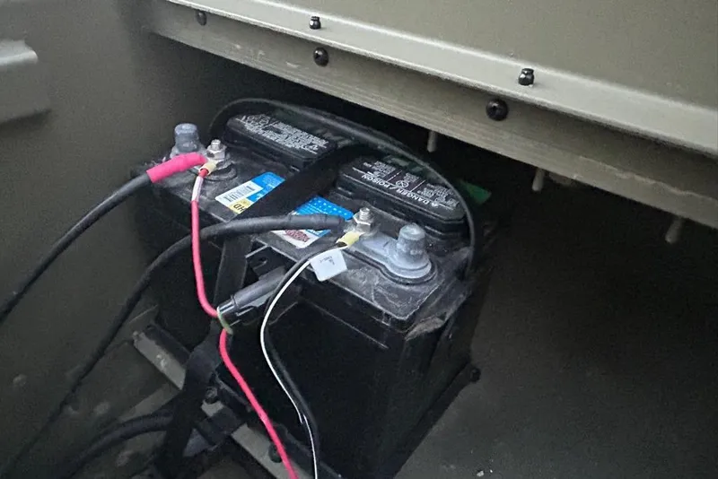 Slide: The Image of 2025 Tracker Grizzly 1860 MVX CC boat on trailer, viewed from below. - 11