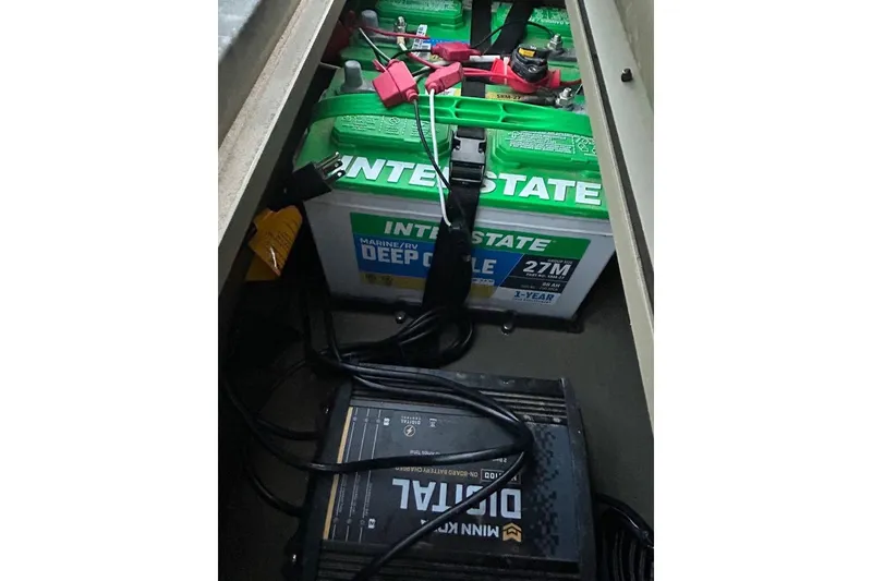 Slide: The Image of 2025 Tracker Grizzly 1860 MVX CC boat hull on trailer, viewed from below. - 12