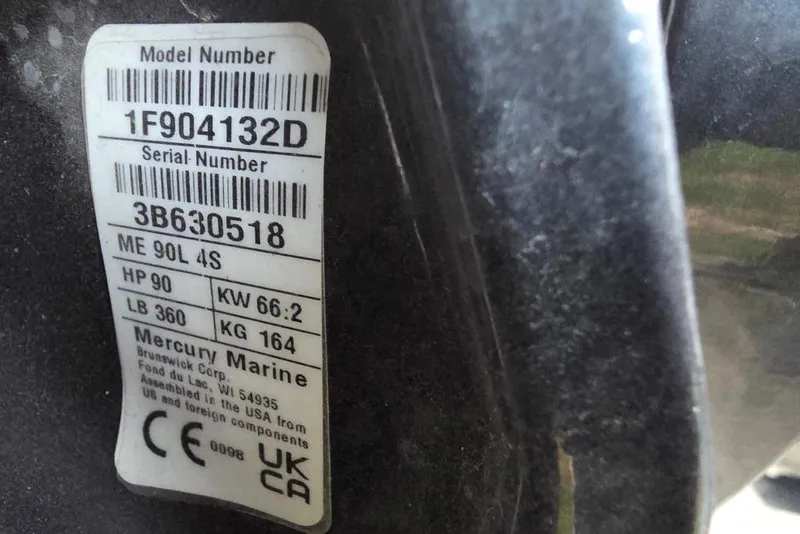 Slide: The Image of 2025 Tracker Grizzly 1860 MVX CC boat with camo seat and fishing equipment. - 15