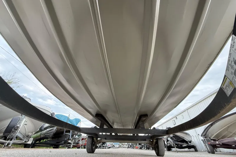 Slide: The Image of Mercury FourStroke engine on 2025 Tracker Grizzly 1860 MVX CC boat, outdoor setting. - 25