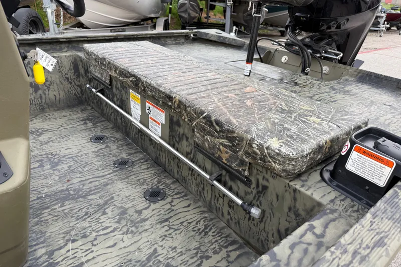 Slide: The Image of 2025 Tracker Grizzly 1860 MVX CC dashboard with Lowrance display and gauges. - 32