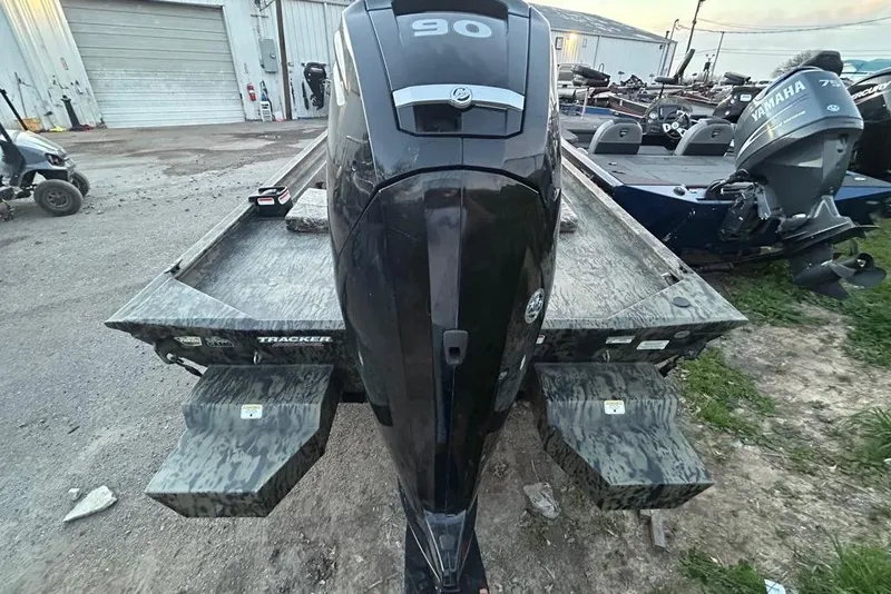 Slide: The Image of 2025 Tracker Grizzly 1860 MVX CC boat with camouflage pattern and "All Welded" logo. - 4