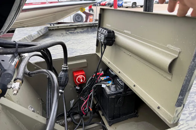 Slide: The Image of 2025 Tracker Grizzly 1860 MVX CC boat on trailer at dealership. - 41