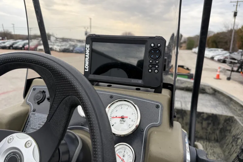 Slide: The Image of 2025 Tracker Grizzly 1860 MVX CC boat with Mercury engine at dealership. - 43