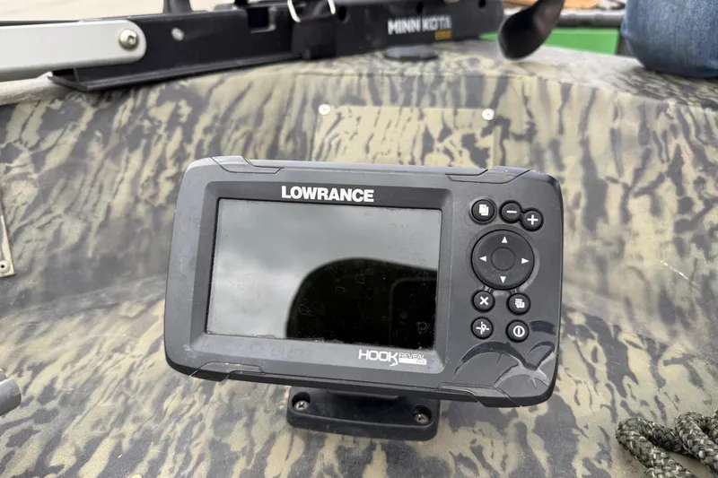 Slide: The Image of Trailer wheel of 2025 Tracker Grizzly 1860 MVX CC on gravel surface. - 45