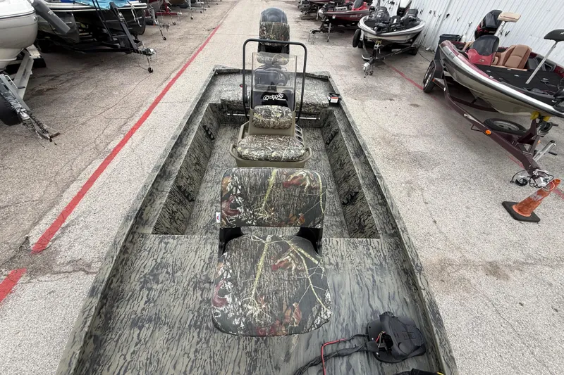 Slide: The Image of 2025 Tracker Grizzly 1860 MVX CC boat with Mercury engine on trailer. - 46