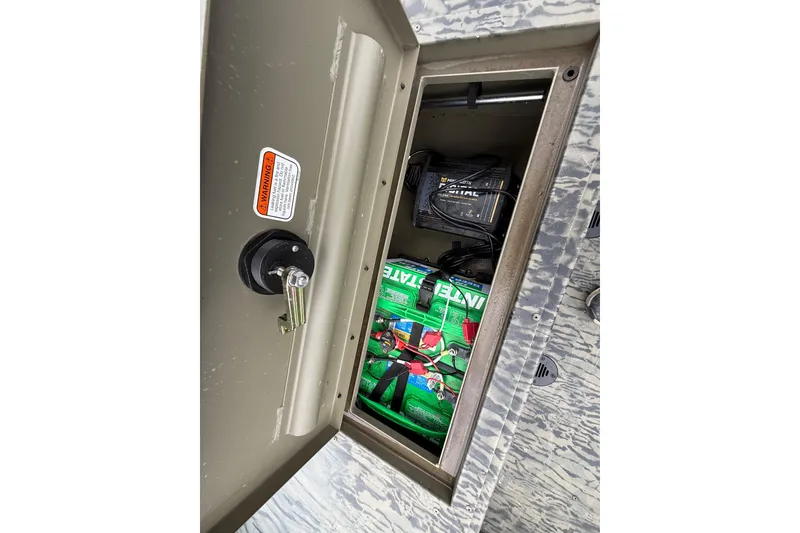 Slide: The Image of 2025 Tracker Grizzly 1860 MVX CC boat with camo seats and Mercury engine. - 47