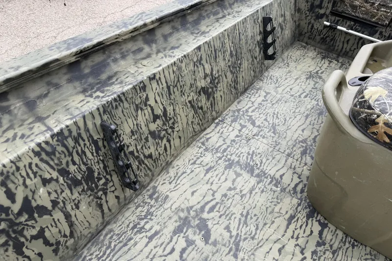 Slide: The Image of 2025 Tracker Grizzly 1860 MVX CC boat on trailer at dealership. - 49