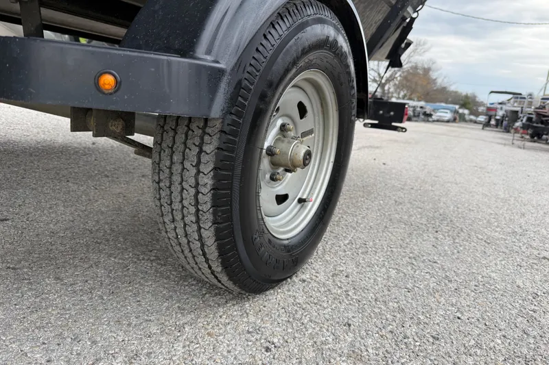 Slide: The Image of 2025 Tracker Grizzly 1860 MVX CC boat with Mercury engine on trailer. - 52