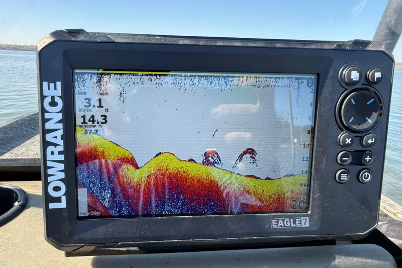 Slide: The Image of Fishfinder display on a 2025 Tracker Grizzly 1860 MVX CC boat, showing underwater terrain. - 65