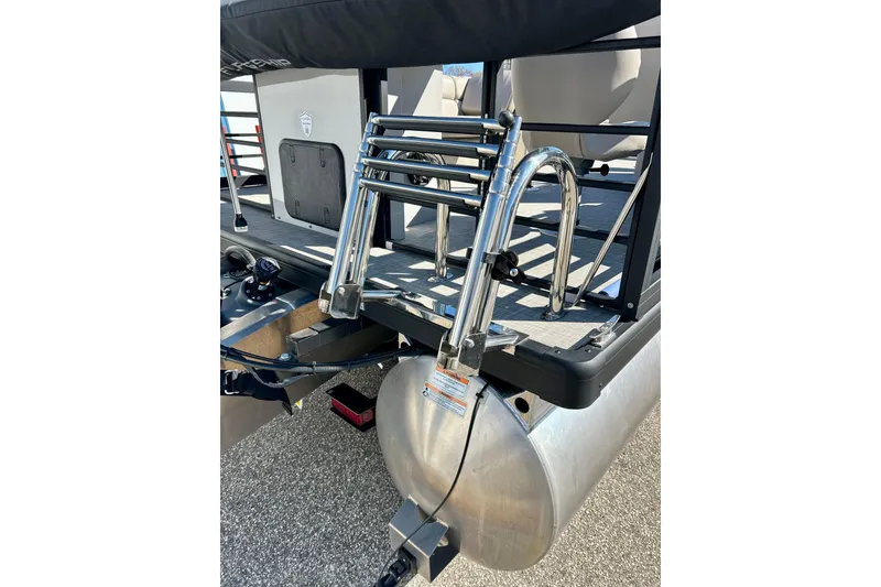 Slide: The Image of 2023 Flagship 200 Lounge Lounger with stainless steel ladder and pontoon detail. - 10