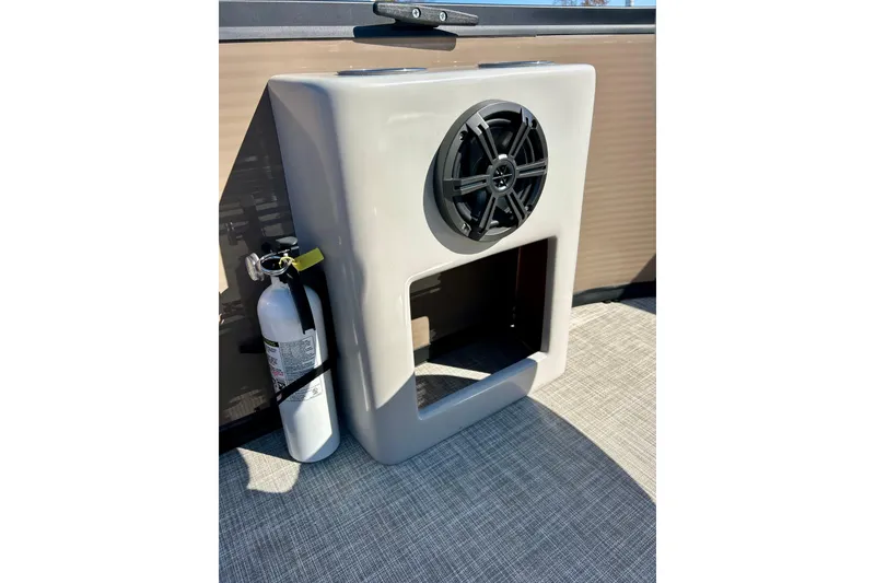 Slide: The Image of Speaker and fire extinguisher on 2023 Flagship 200 Lounge Lounger boat. - 21