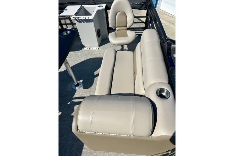 Slide: The Image of Luxurious 2023 Flagship 200 Lounge Lounger with beige seating and cup holders on a boat deck. - 23