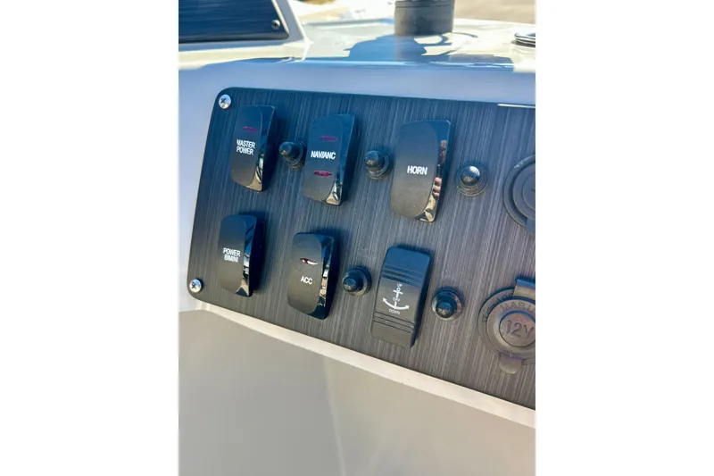 Slide: The Image of Control panel of 2023 Flagship 200 Lounge Lounger with various switches and buttons. - 30