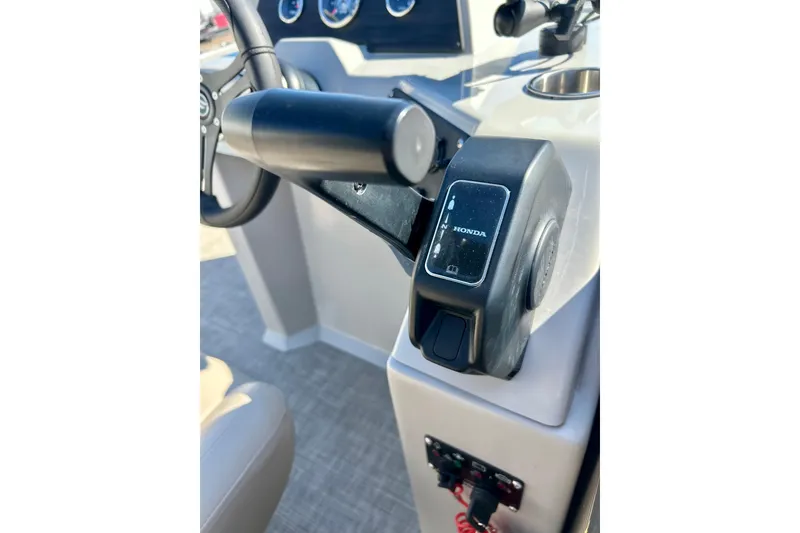 Slide: The Image of 2023 Flagship 200 Lounge Lounger boat control panel with Honda throttle. - 33
