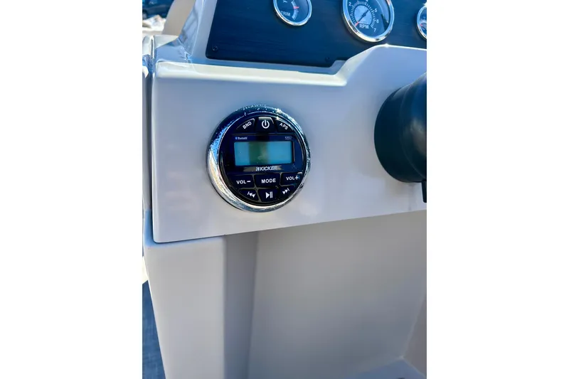 Slide: The Image of Control panel of 2023 Flagship 200 Lounge Lounger with audio system and gauges. - 34