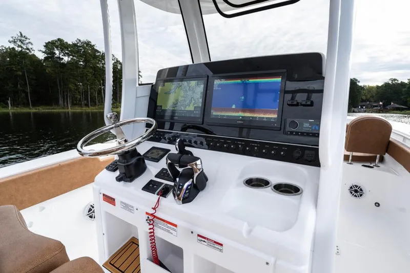 Slide: The Image of Manufacturer Provided Image: 2026 Sea Hunt Ultra 285 SE boat dashboard with advanced navigation screens and controls. - 5