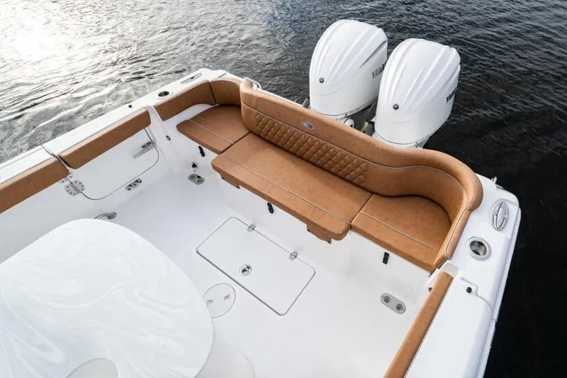 Slide: The Image of Manufacturer Provided Image: 2026 Sea Hunt Ultra 285 SE boat with tan seating and dual Yamaha engines. - 8