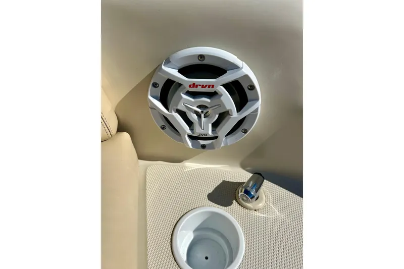 Slide: The Image of White JVC speaker on 2000 Sea Ray 240 Sundeck boat interior. - 30