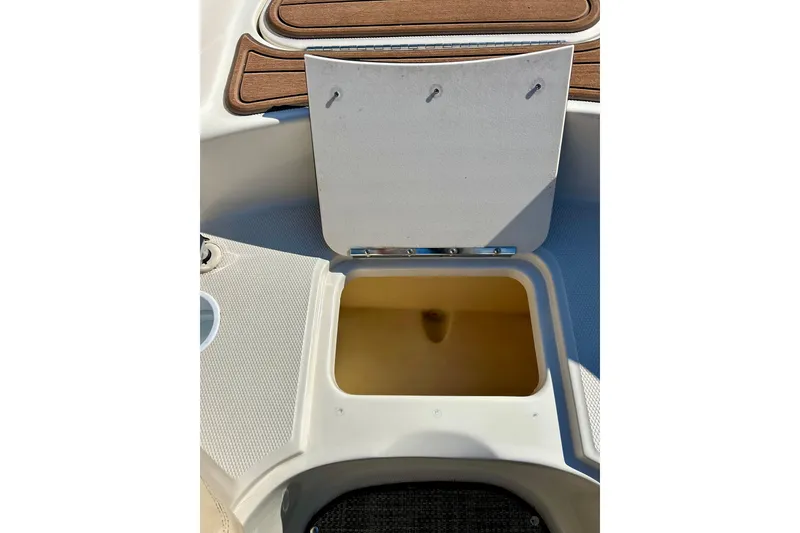 Slide: The Image of Speaker and cup holder on 2000 Sea Ray 240 Sundeck boat interior. - 31