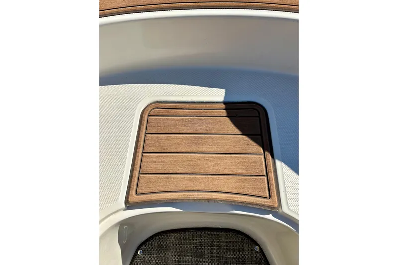 Slide: The Image of Open storage compartment on a 2000 Sea Ray 240 Sundeck boat. - 32
