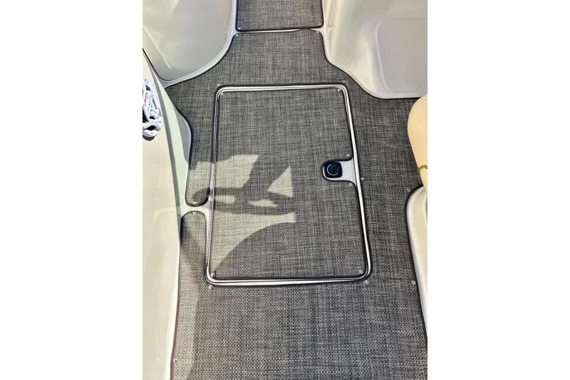 Slide: The Image of 2000 Sea Ray 240 Sundeck boat deck with wood finish and cup holder. - 34