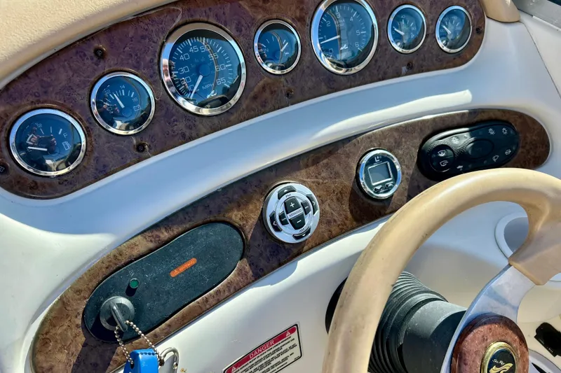 Slide: The Image of Open storage compartment on 2000 Sea Ray 240 Sundeck boat. - 36