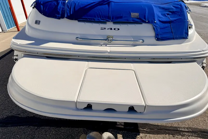 Slide: The Image of Rear view of a 2000 Sea Ray 240 Sundeck boat with propeller and swim platform. - 44