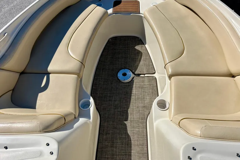 Slide: The Image of Interior of 2000 Sea Ray 240 Sundeck boat, featuring a compact sink and mirror. - 49
