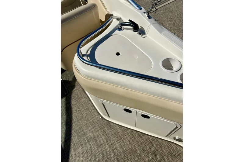 Slide: The Image of 2000 Sea Ray 240 Sundeck boat interior with seating and windshield. - 53