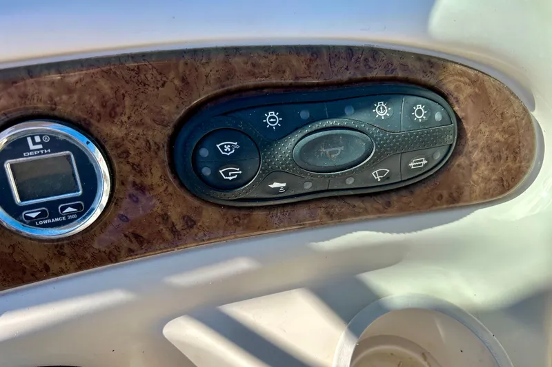 Slide: The Image of 2000 Sea Ray 240 Sundeck boat interior with sink and storage compartments. - 55