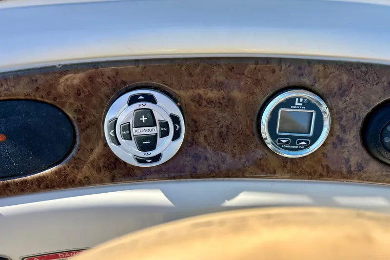 Slide: The Image of Control panel of a 2000 Sea Ray 240 Sundeck boat with depth gauge. - 56