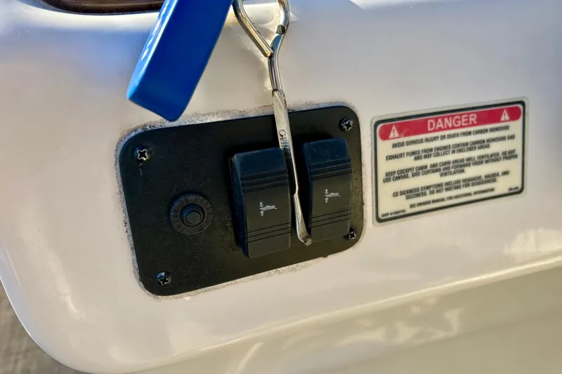 Slide: The Image of Dashboard of 2000 Sea Ray 240 Sundeck with gauges and controls. - 58