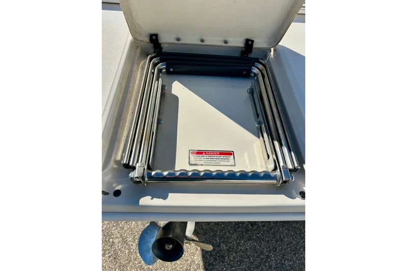 Slide: The Image of Rear view of 2000 Sea Ray 240 Sundeck with propeller and swim platform. - 60