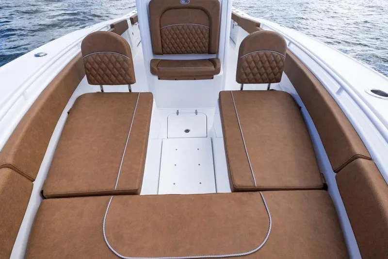 Slide: The Image of Luxurious seating on 2026 Sea Hunt Ultra 275 SE boat, featuring brown cushioned upholstery. - 11