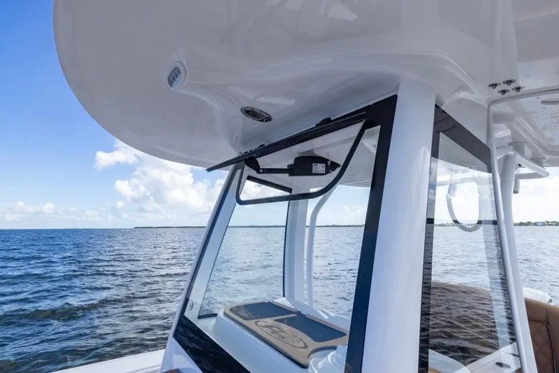 Slide: The Image of 2026 Sea Hunt Ultra 275 SE boat on open water, showcasing sleek design and modern features. - 13