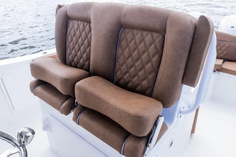 Slide: The Image of Luxurious brown seating on 2026 Sea Hunt Ultra 275 SE boat, featuring diamond stitching. - 17