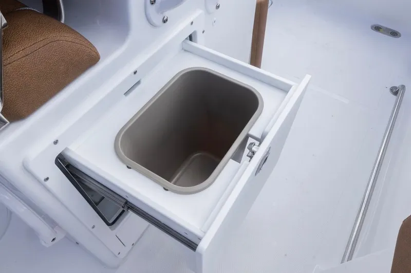 Slide: The Image of Open storage compartment on 2026 Sea Hunt Ultra 275 SE boat. - 19