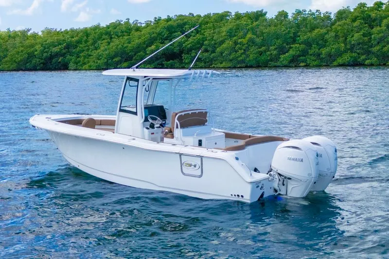Slide: The Image of 2026 Sea Hunt Ultra 275 SE boat on water, featuring dual Yamaha engines. - 2
