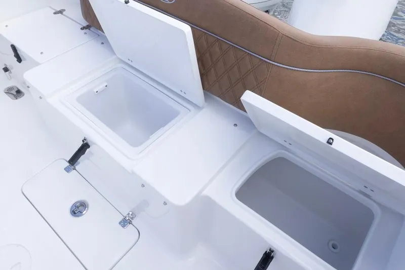 Slide: The Image of 2026 Sea Hunt Ultra 275 SE boat storage compartments and seating detail. - 22