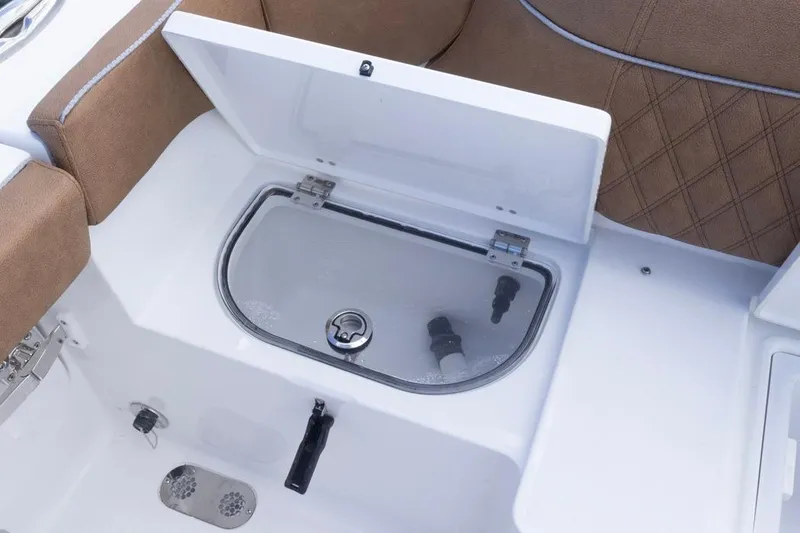 Slide: The Image of Livewell compartment on 2026 Sea Hunt Ultra 275 SE boat with cushioned seating. - 23