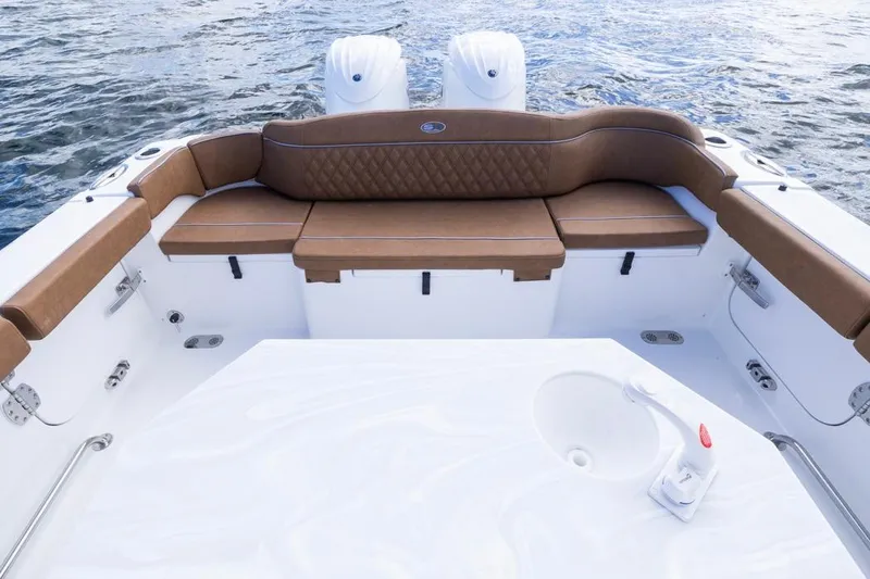 Slide: The Image of Luxurious seating on 2026 Sea Hunt Ultra 275 SE boat, featuring elegant brown upholstery. - 26