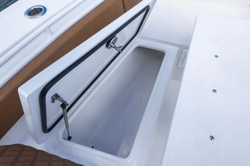 Slide: The Image of Open storage compartment on 2026 Sea Hunt Ultra 275 SE boat. - 4